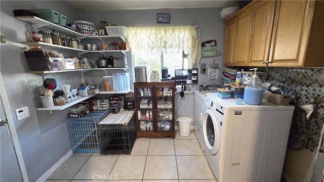 1954 Elizabeth Ave, Corning, CA 96021 - clothes washing area with light tile patterned flooring, washer and clothes dryer, and laundry area