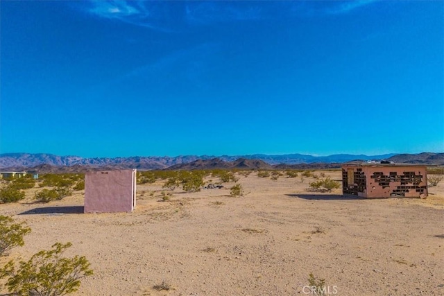 property view of mountains with a desert view and a rural view