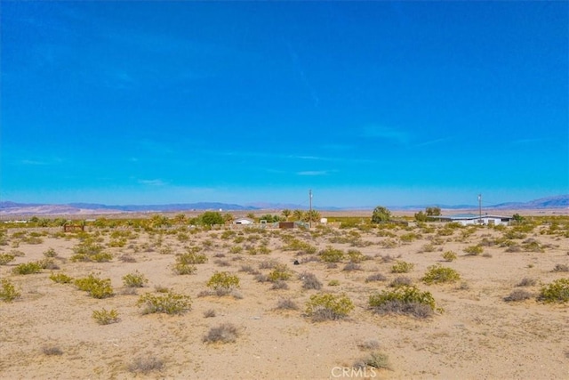 property view of mountains with a rural view and view of desert