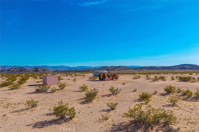 property view of mountains with a rural view and view of desert