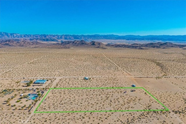 bird's eye view with view of desert, a rural view, and a mountain view