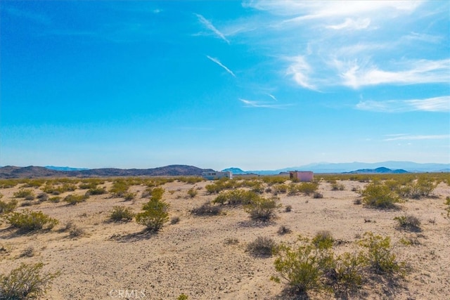 view of mountain feature with a desert view and a rural view
