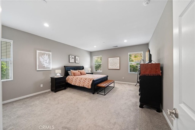 bedroom with recessed lighting, baseboards, and carpet