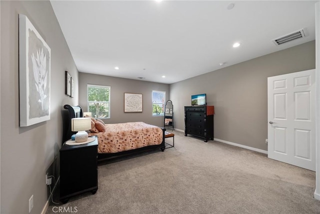 carpeted bedroom with visible vents, recessed lighting, and baseboards