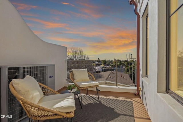 view of balcony at dusk