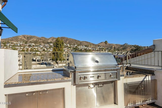 view of patio / terrace featuring a mountain view and area for grilling
