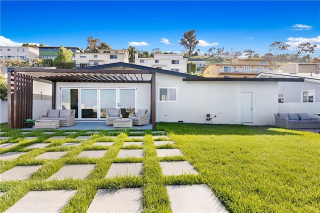rear view of property with a pergola, outdoor lounge area, a patio area, a lawn, and stucco siding