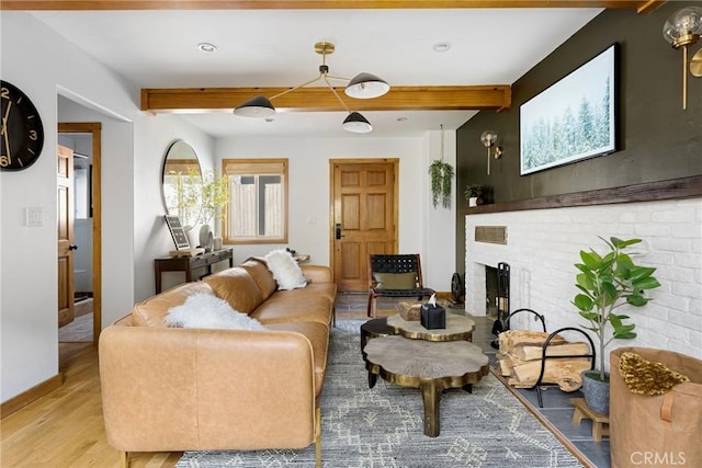 29387 Lake View Dr, Cedar Glen, CA 92321 - living room featuring baseboards, light wood finished floors, a brick fireplace, and beam ceiling