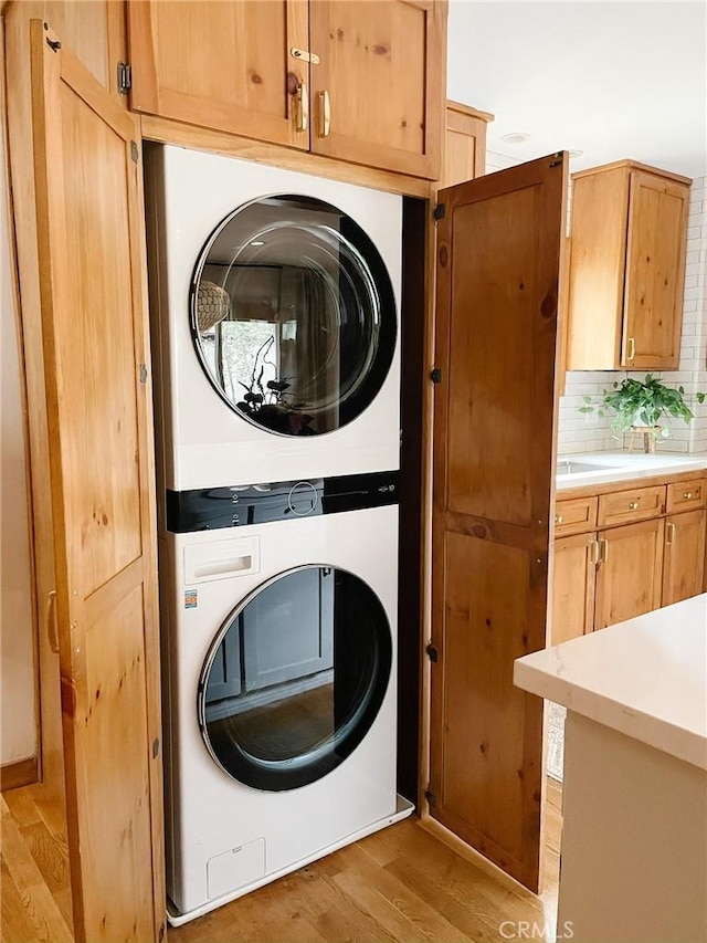 29387 Lake View Dr, Cedar Glen, CA 92321 - washroom featuring laundry area, light wood-style flooring, and stacked washer and clothes dryer