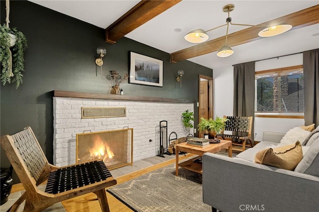 29387 Lake View Dr, Cedar Glen, CA 92321 - living area with beam ceiling, wood finished floors, and a brick fireplace