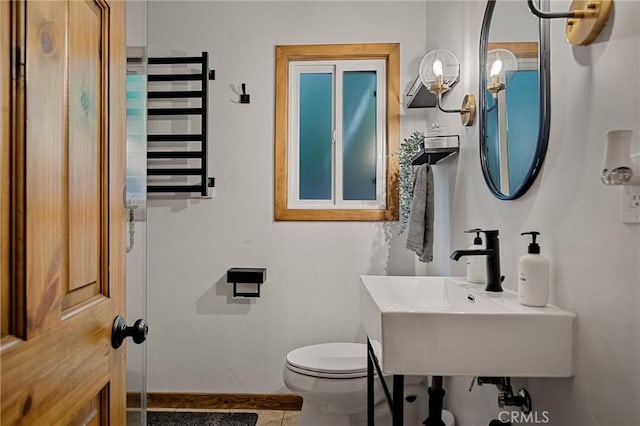 29387 Lake View Dr, Cedar Glen, CA 92321 - half bathroom featuring radiator and tile patterned flooring