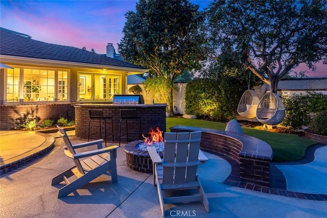 1232 Blue Gum Ln, Newport Beach, CA 92660 - patio terrace at dusk with a fire pit and outdoor dry bar