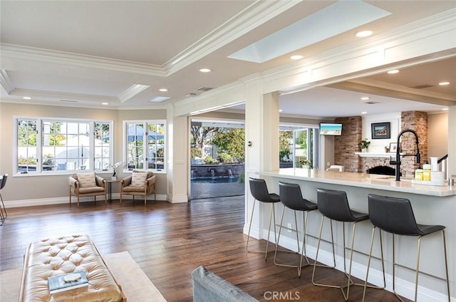 1232 Blue Gum Ln, Newport Beach, CA 92660 - interior space with crown molding, baseboards, open floor plan, a kitchen bar, and dark wood-type flooring