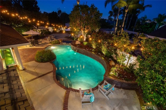 1232 Blue Gum Ln, Newport Beach, CA 92660 - pool at night with an outdoor pool and a patio area