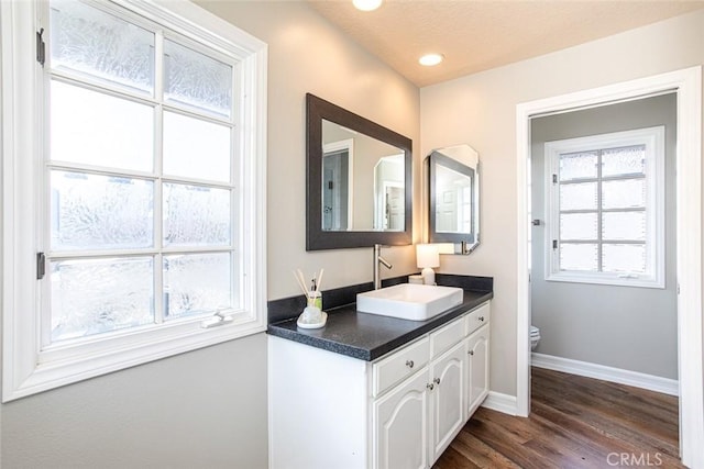 1232 Blue Gum Ln, Newport Beach, CA 92660 - bathroom featuring recessed lighting, vanity, toilet, baseboards, and wood finished floors