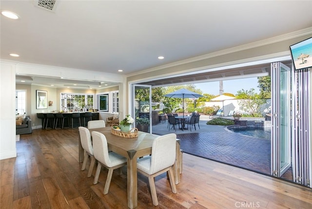 1232 Blue Gum Ln, Newport Beach, CA 92660 - dining room featuring hardwood / wood-style floors, visible vents, ornamental molding, and recessed lighting