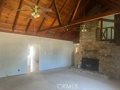 635 N 3rd St, Chowchilla, CA 93610 - unfurnished living room with a ceiling fan, a fireplace, high vaulted ceiling, beamed ceiling, and wood ceiling