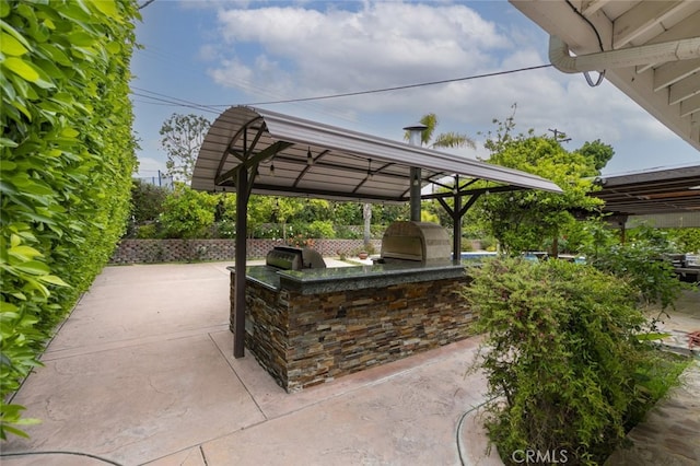 view of patio featuring exterior kitchen