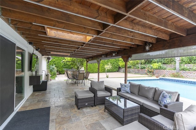view of patio featuring an outdoor living space, outdoor dining area, and a fenced in pool
