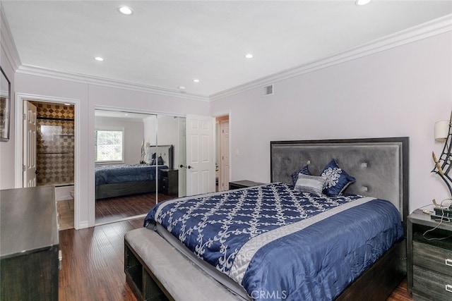 bedroom with visible vents, ornamental molding, a closet, wood finished floors, and recessed lighting