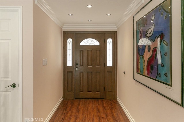 interior space with baseboards, ornamental molding, recessed lighting, and wood finished floors