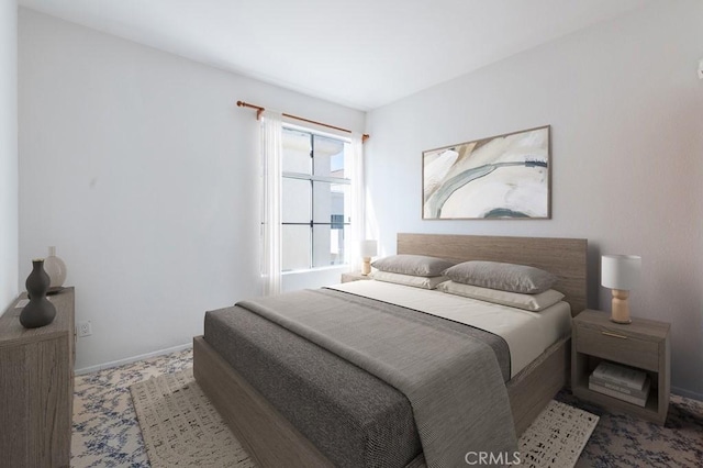 bedroom featuring baseboards