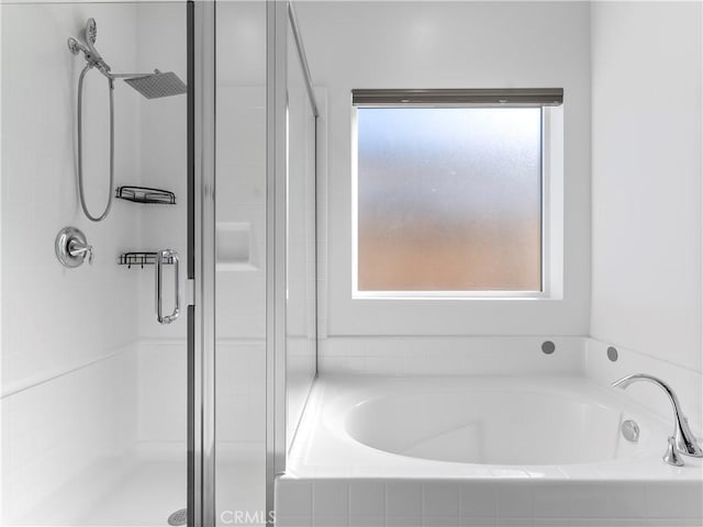 5211 Wingspan Ln, Bakersfield, CA 93306 - bathroom featuring a garden tub and a shower stall