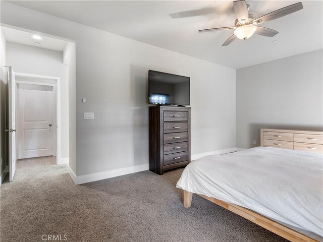 5211 Wingspan Ln, Bakersfield, CA 93306 - carpeted bedroom with baseboards and ceiling fan