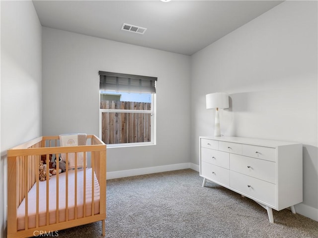 5211 Wingspan Ln, Bakersfield, CA 93306 - bedroom with visible vents, baseboards, a nursery area, and carpet floors