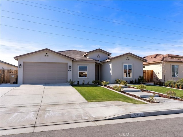 5211 Wingspan Ln, Bakersfield, CA 93306 - single story home featuring stucco siding, driveway, and an attached garage
