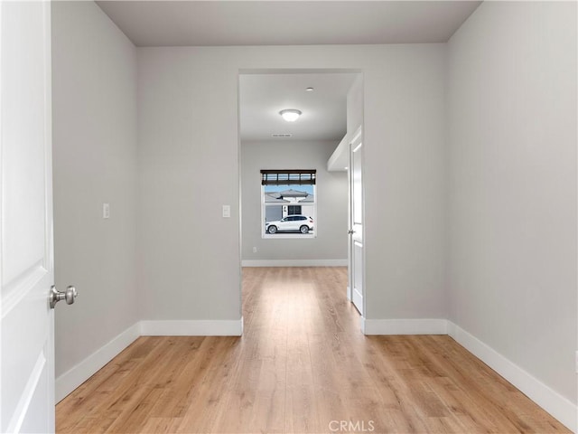 5211 Wingspan Ln, Bakersfield, CA 93306 - corridor featuring light wood-style flooring and baseboards
