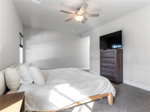 5211 Wingspan Ln, Bakersfield, CA 93306 - bedroom featuring a ceiling fan, carpet flooring, and baseboards