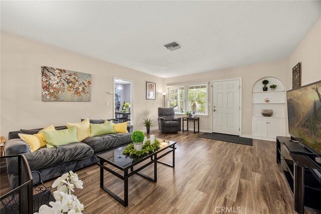 1229 Central Ave, Fullerton, CA 92831 - living area featuring wood finished floors, baseboards, and built in features