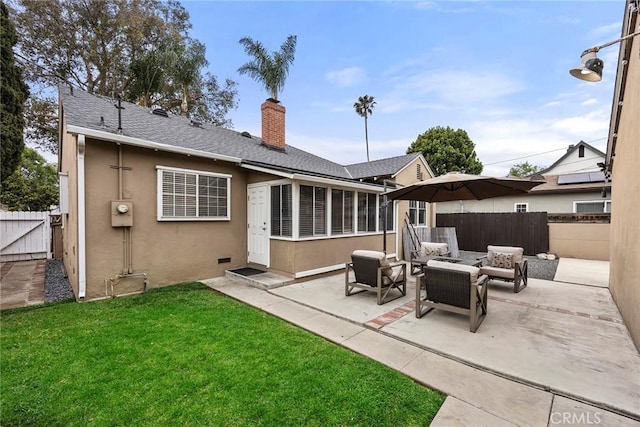 1229 Central Ave, Fullerton, CA 92831 - rear view of house with an outdoor living space, a patio, a chimney, stucco siding, and a sunroom