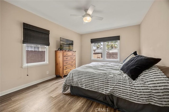 1229 Central Ave, Fullerton, CA 92831 - bedroom with wood finished floors, baseboards, and ceiling fan