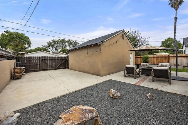 1229 Central Ave, Fullerton, CA 92831 - view of patio / terrace featuring a fenced backyard, outdoor lounge area, and a gate