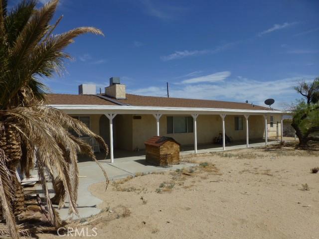 3465 Condor Rd Unit 29, Palms, CA 92277 - back of house featuring a chimney