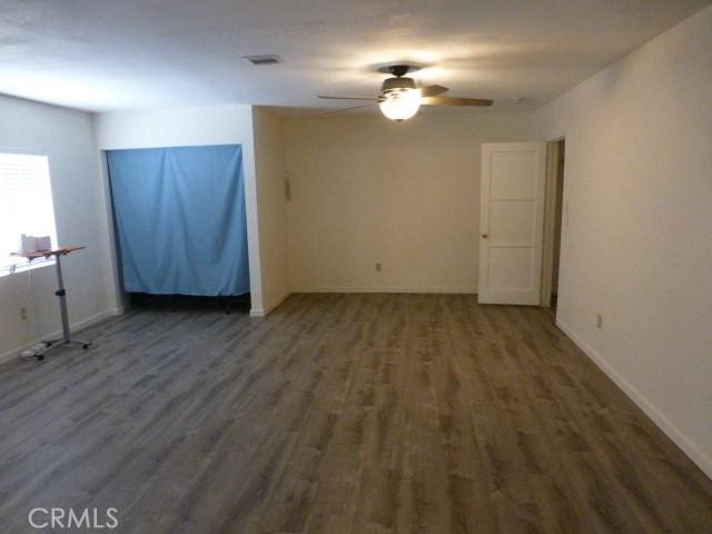 3465 Condor Rd Unit 29, Palms, CA 92277 - unfurnished room with wood finished floors, baseboards, and ceiling fan