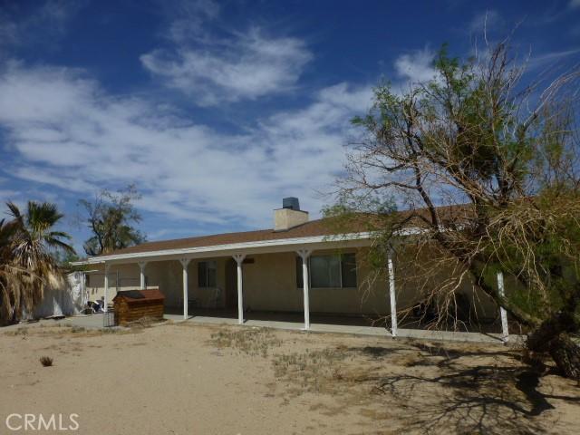 3465 Condor Rd Unit 29, Palms, CA 92277 - rear view of property featuring a chimney
