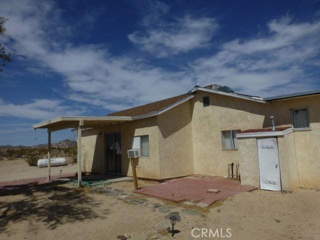 3465 Condor Rd Unit 29, Palms, CA 92277 - back of house with stucco siding