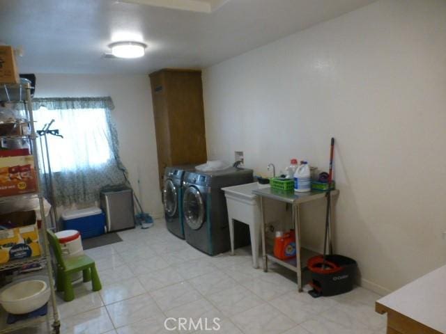 3465 Condor Rd Unit 29, Palms, CA 92277 - washroom with washing machine and dryer and laundry area