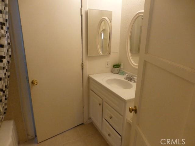 3465 Condor Rd Unit 29, Palms, CA 92277 - full bathroom with a shower with curtain, tile patterned floors, and vanity