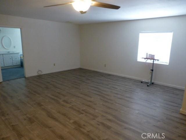 3465 Condor Rd Unit 29, Palms, CA 92277 - unfurnished room with wood finished floors, baseboards, and ceiling fan