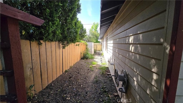 view of side of home with fence