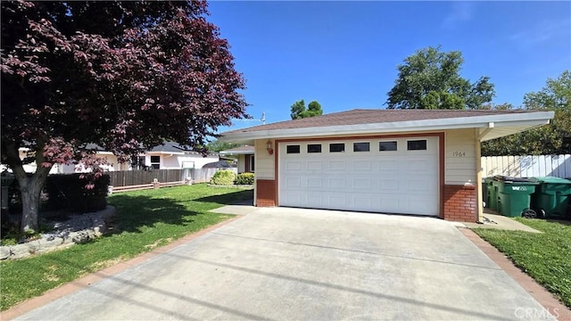detached garage featuring fence