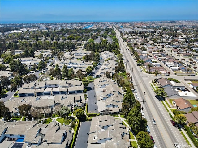 aerial view of property and surrounding area with nearby suburban area