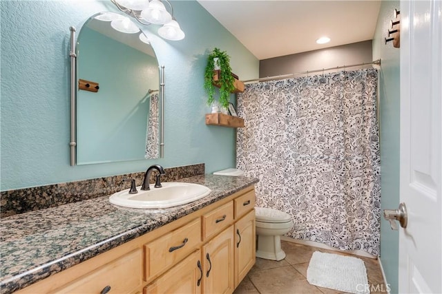full bath with toilet, a shower with shower curtain, tile patterned flooring, and vanity