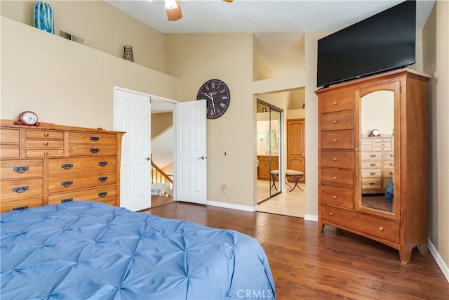 bedroom featuring high vaulted ceiling, baseboards, a ceiling fan, and dark wood finished floors