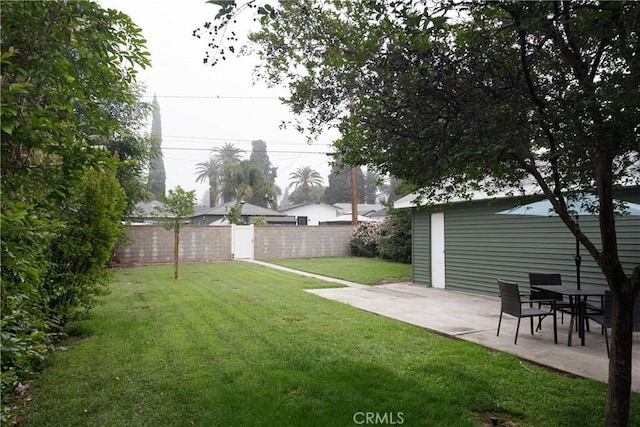 view of yard with fence and a patio area