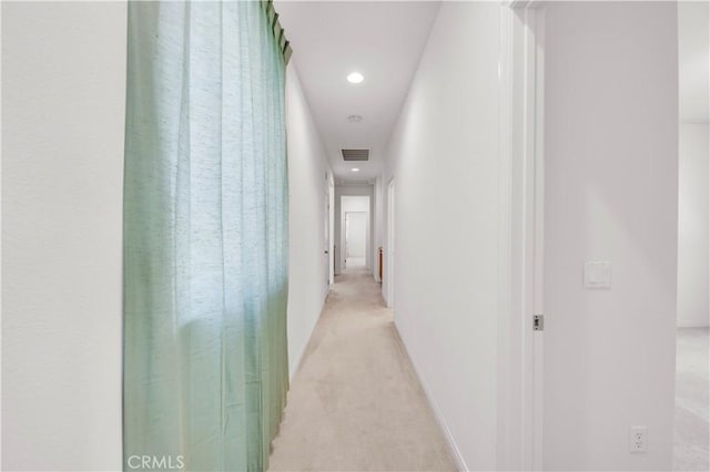 hallway featuring recessed lighting, visible vents, light carpet, and baseboards